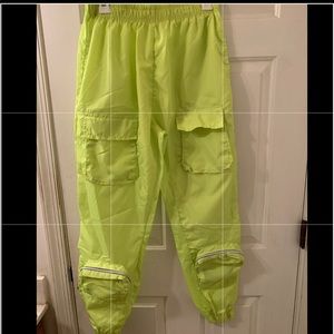Neon swish joggers elastic waist 2 mid pockets 2 zip lower pockets worn once